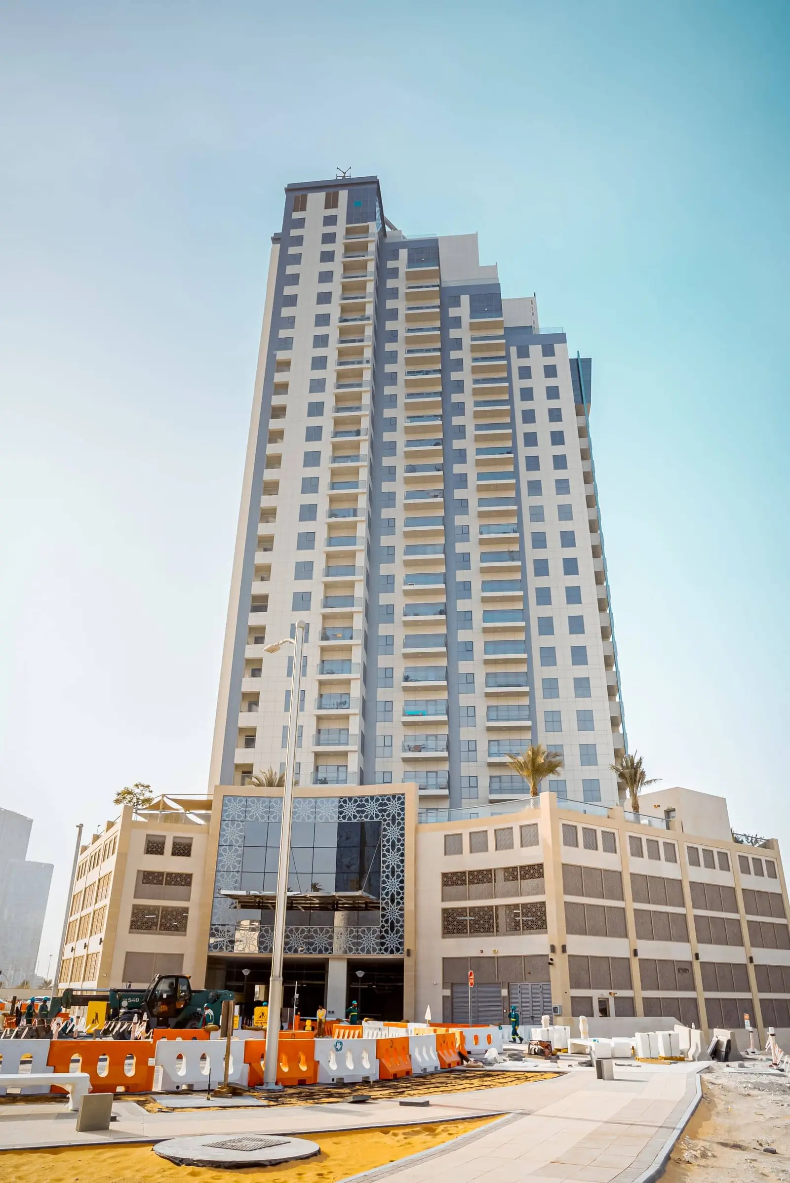 Scenic waterfront promenade and high rise skyline view surrounding Marina Rise Tower in Al Reem Island Abu Dhabi.