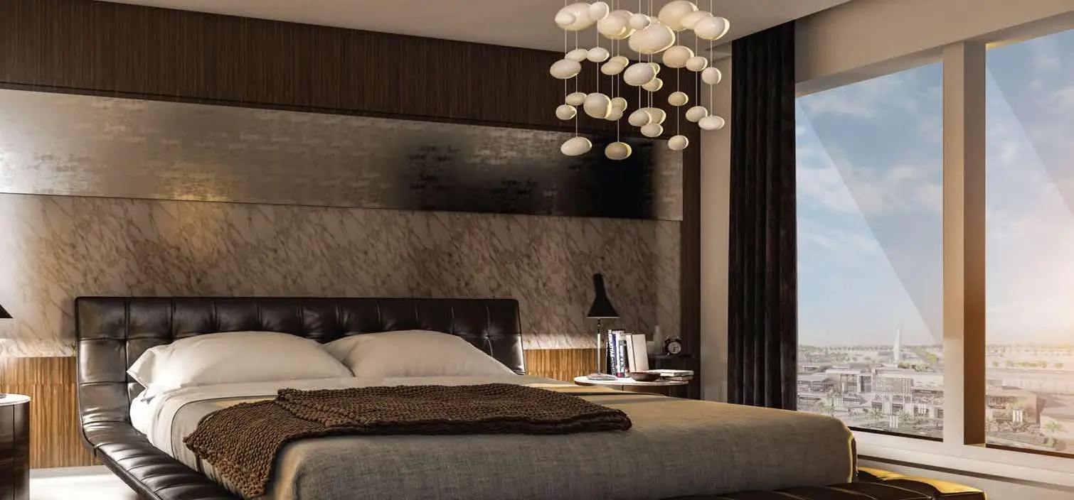 Architectural duplex interior showing floating staircase and high ceilings at Park View Tower in Shams Abu Dhabi, UAE.