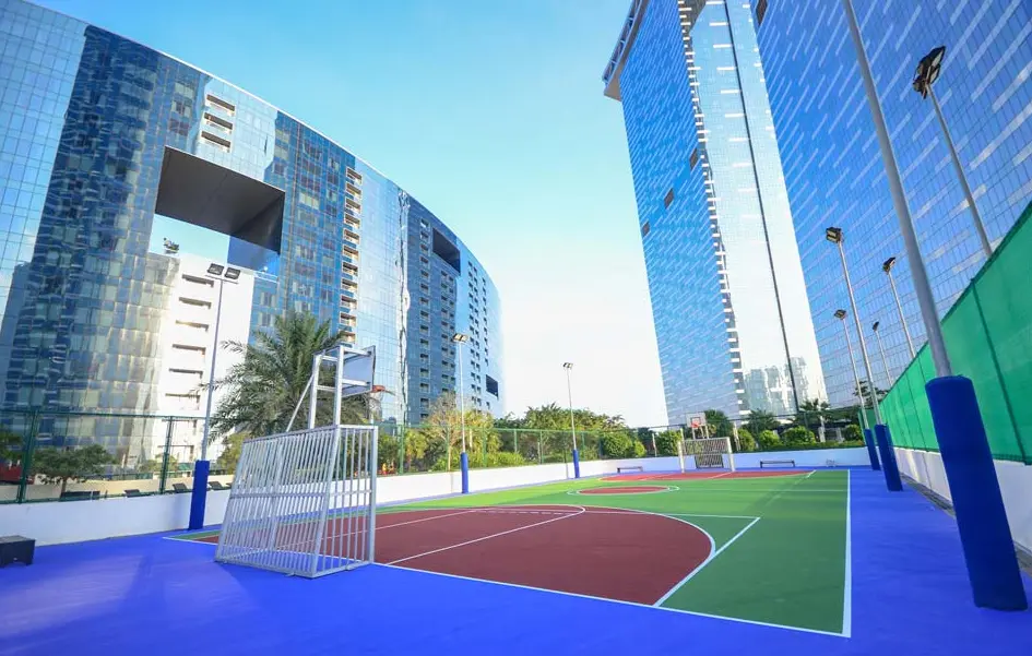 Exterior view of Park View Tower's entrance and ground floor retail spaces in Shams Abu Dhabi.