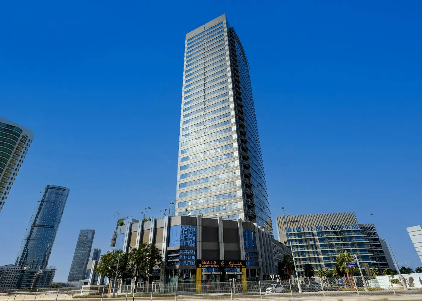 Modern high-rise residential exterior of Al Wifaq Tower located in Shams Abu Dhabi, Al Reem Island, UAE.