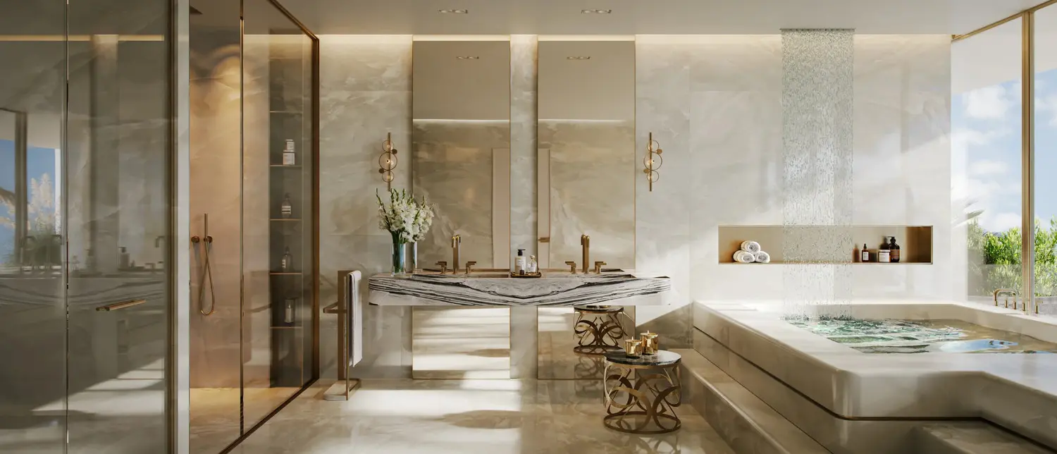Opulent marble en-suite bathroom at Elie Saab Waterfront Abu Dhabi featuring standalone soaking tub and dual vanities.