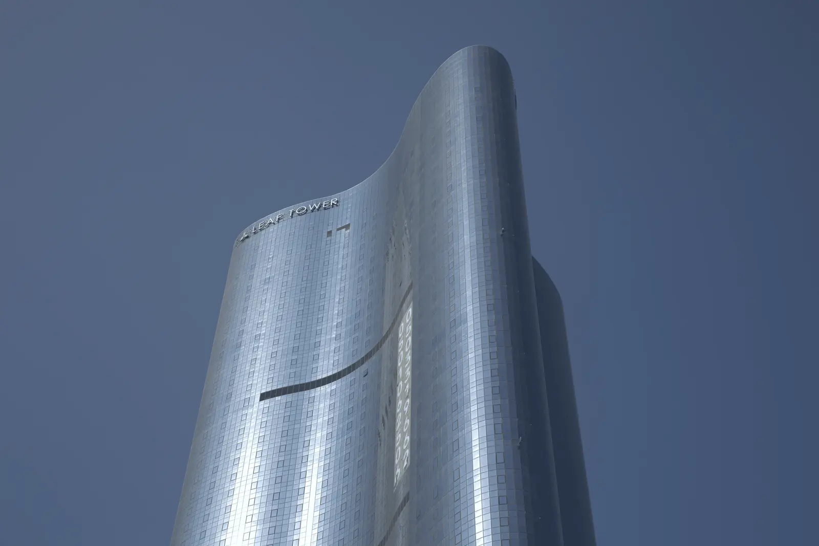 Modern exterior view of Leaf Tower surrounded by the vibrant Al Reem Island community.