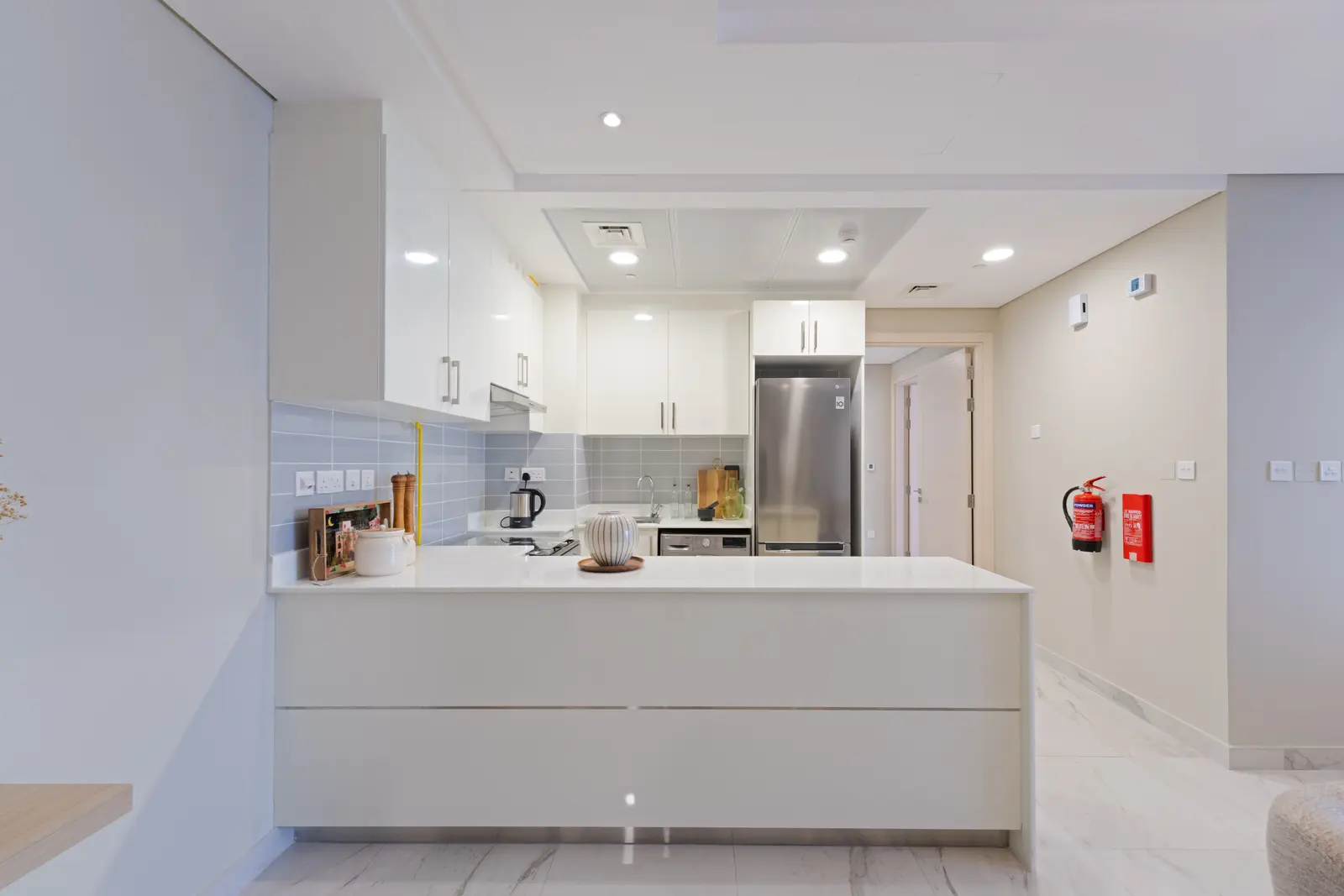 Contemporary kitchen at Leaf Tower featuring sleek cabinetry and quality finishes.