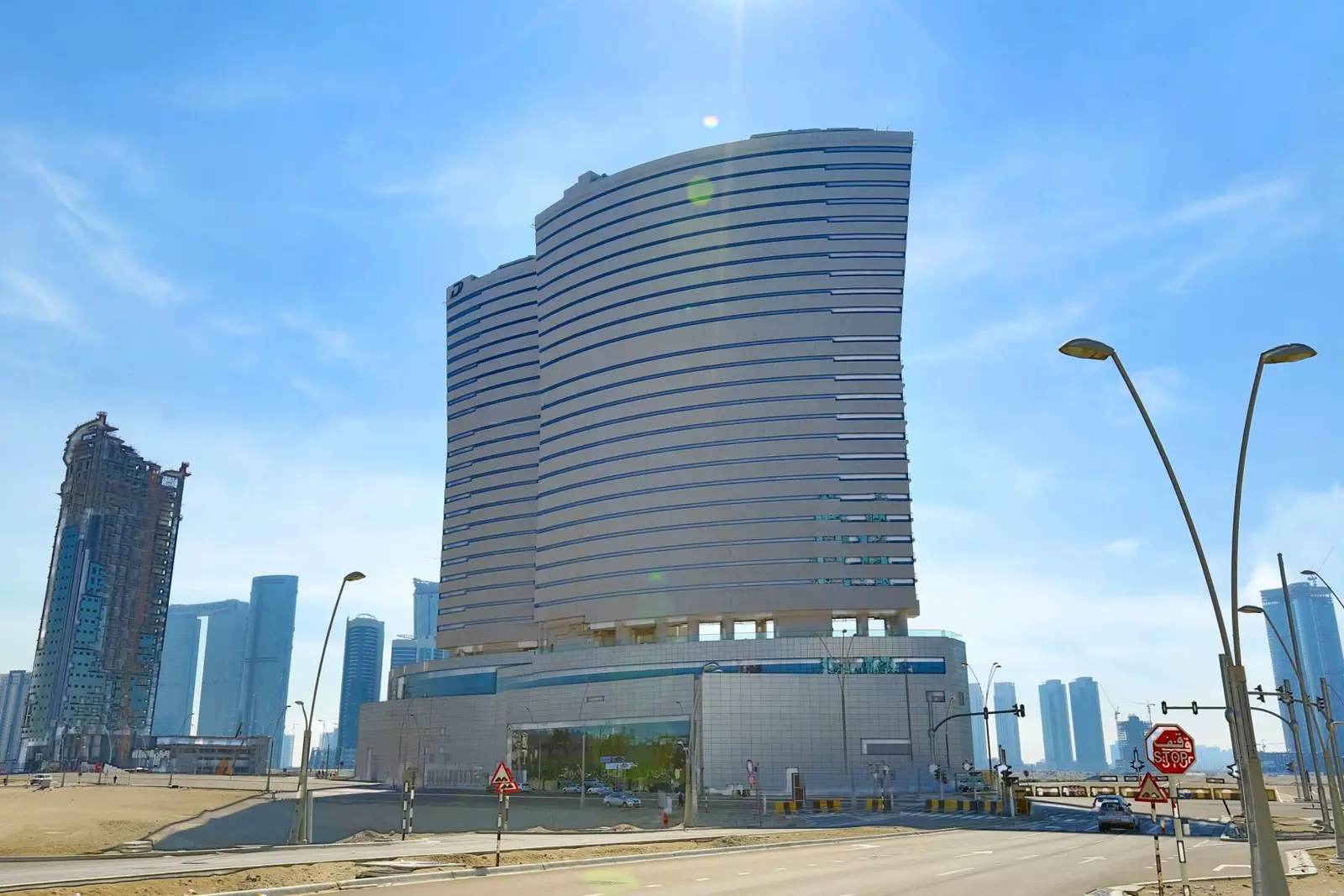 Oceanscape by Damac exterior facade rising above Al Reem Island, Abu Dhabi, featuring modern glass and aluminium waterfront architecture