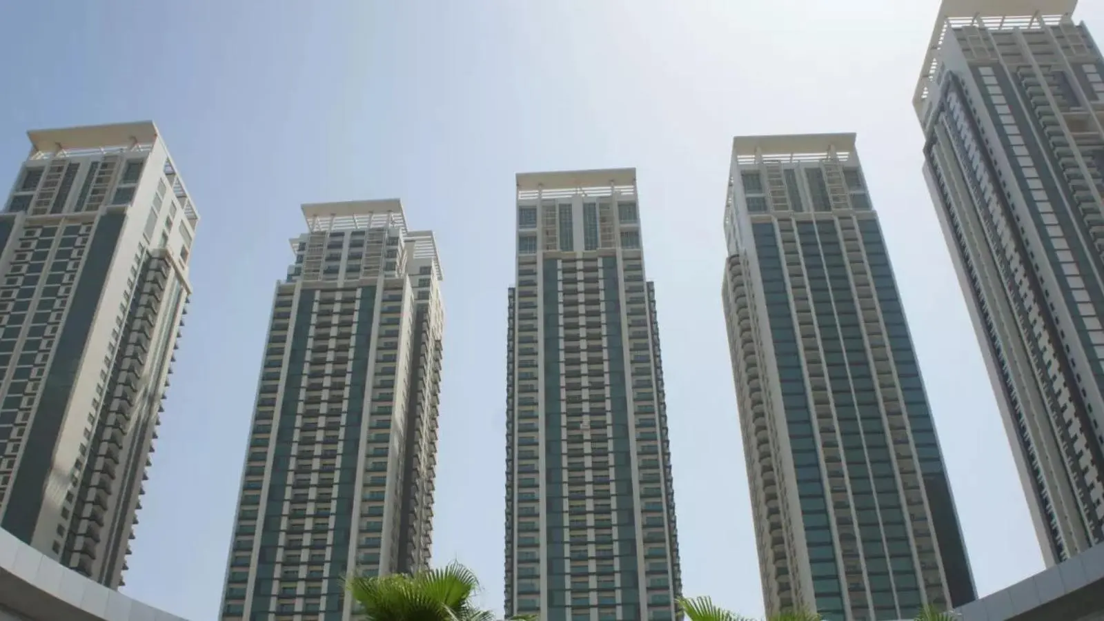 Waterfront exterior of Marina Heights in Marina Square, Al Reem Island, Abu Dhabi, featuring luxury residential towers and urban skyline views.