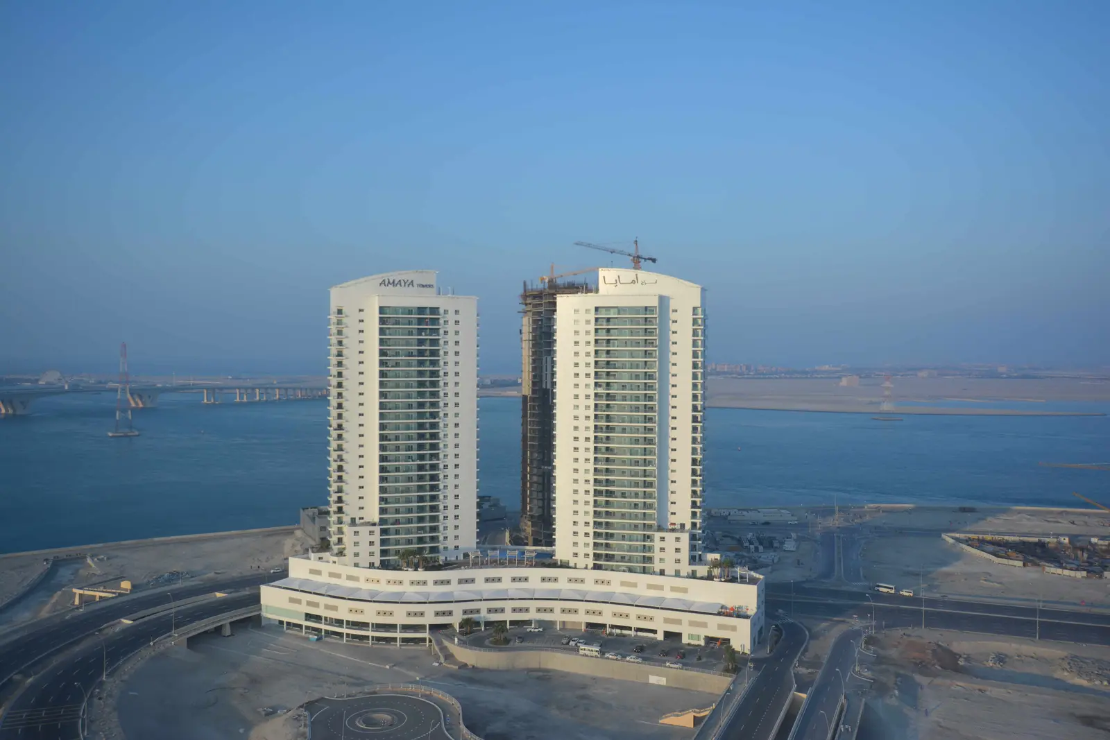 Amaya Towers exterior in Shams Abu Dhabi, Al Reem Island featuring twin residential towers and stunning waterfront architecture.