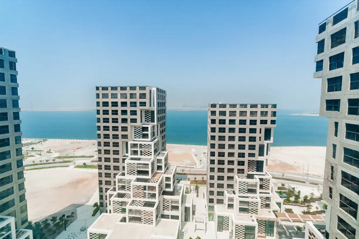 Pixel residential towers featuring sleek modern lines, glass elements, and a lively waterfront setting.