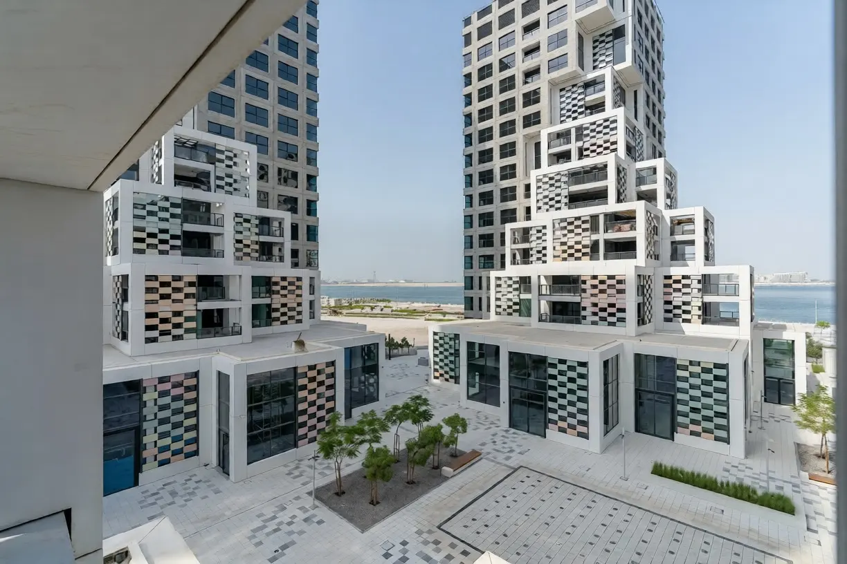 Pixel Al Reem Island exterior with modern buildings, retail promenade, and community‑focused urban layout.