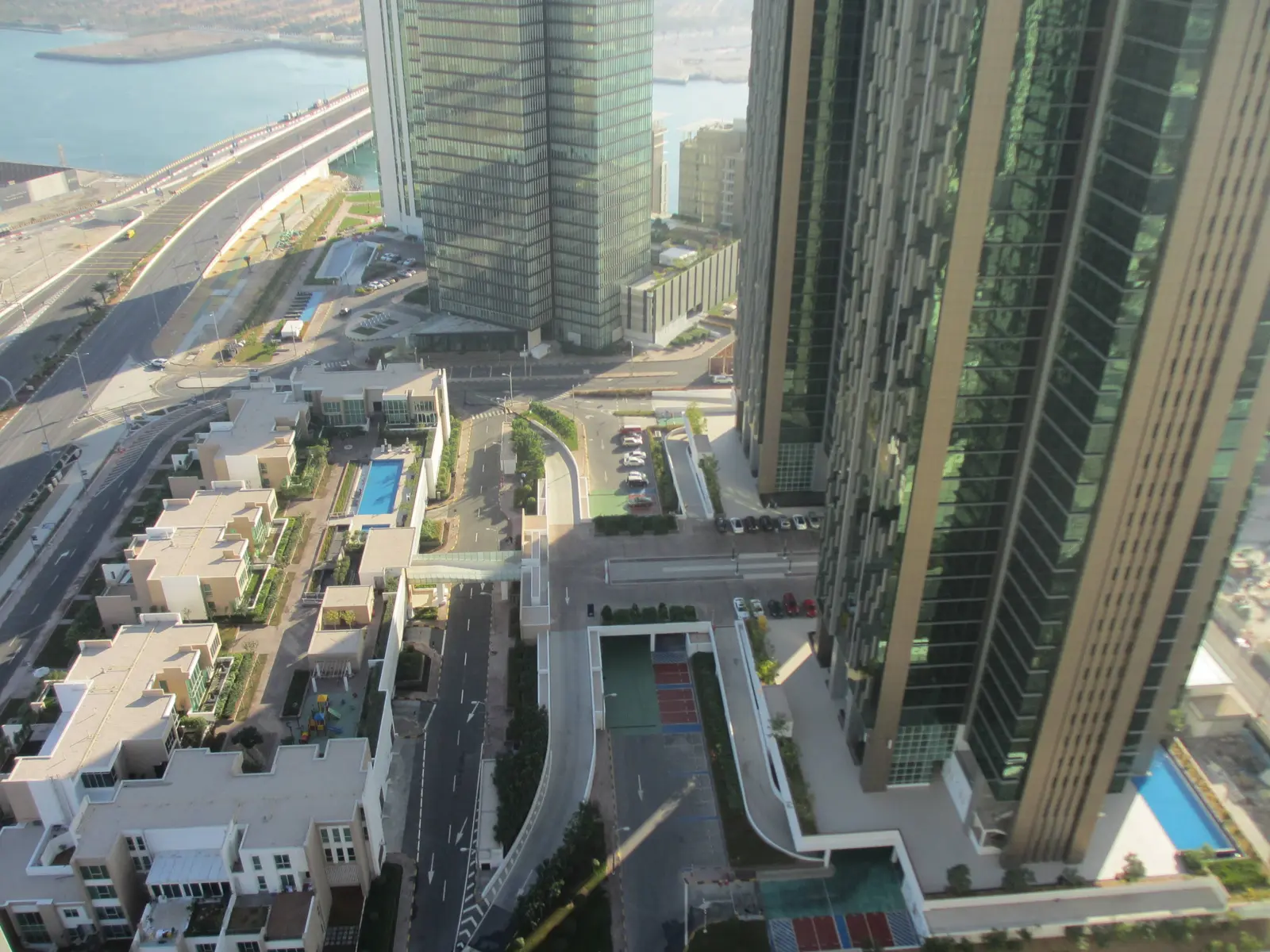 Waterfront perspective of Marina Blue Tower, Marina Square, Al Reem Island showcasing elegant high-rise apartments and scenic coastal views.