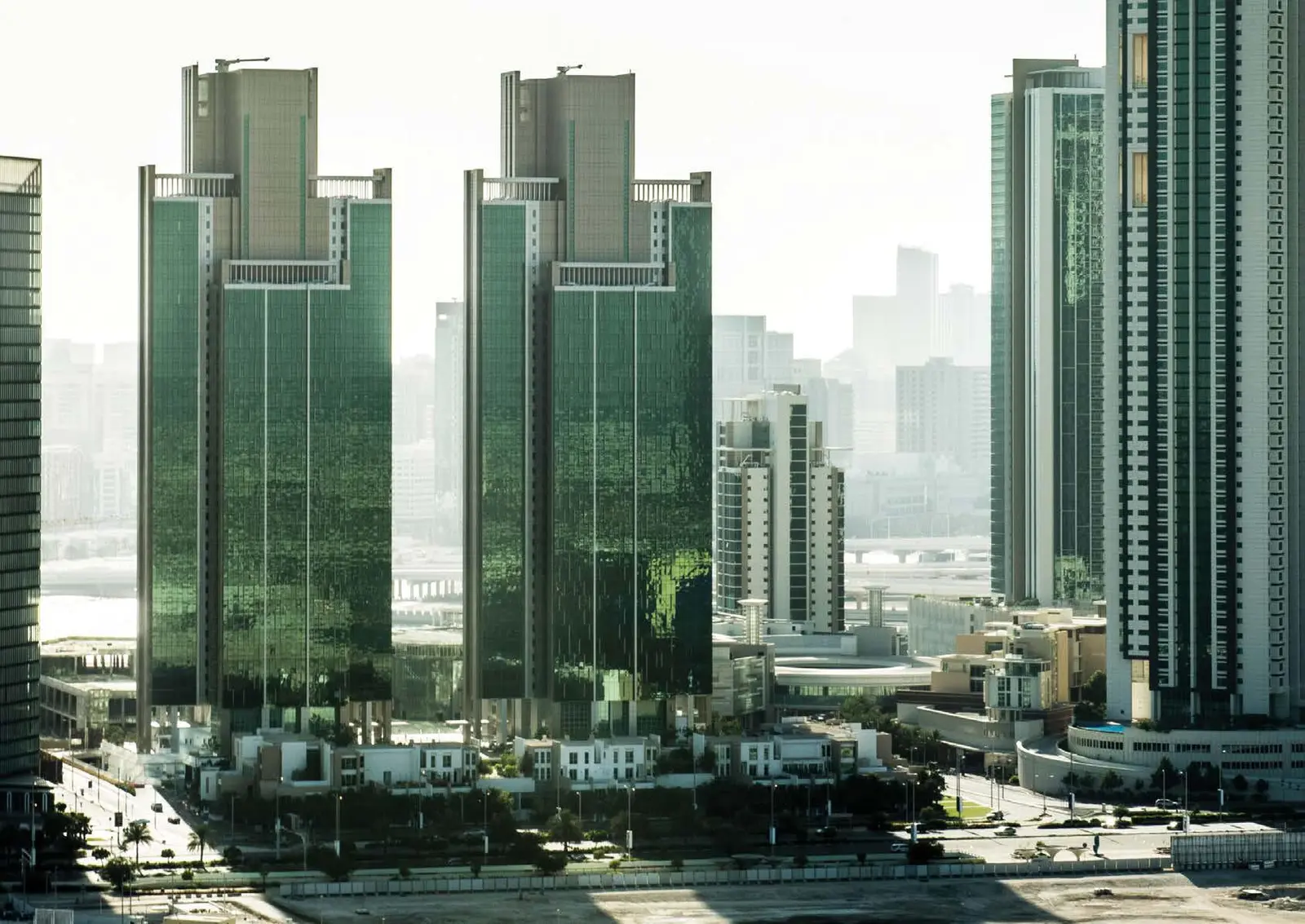 Al Durrah Tower Al Reem Island modern glass exterior overlooking Marina Square with luxury apartments and waterfront residential atmosphere.