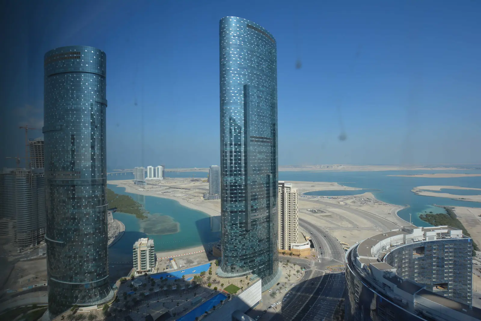 Sky Tower Al Reem Island Abu Dhabi exterior showing its curved modern façade rising above the waterfront skyline