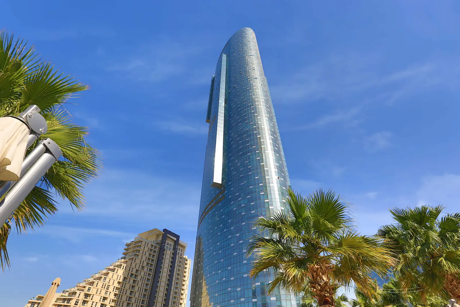 Sky Tower Al Reem Island Abu Dhabi luxury penthouse living area showcasing expansive glass walls and high‑end contemporary design.