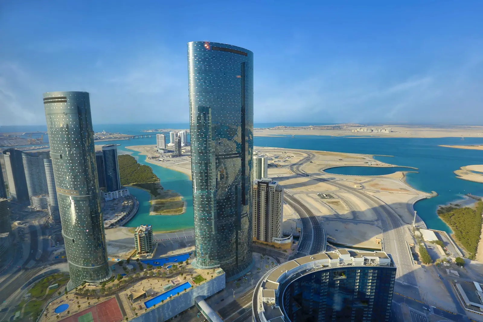 Sun Tower skyline presence in Shams Abu Dhabi, featuring its striking glass exterior and upscale residential architecture overlooking the Arabian Gulf.