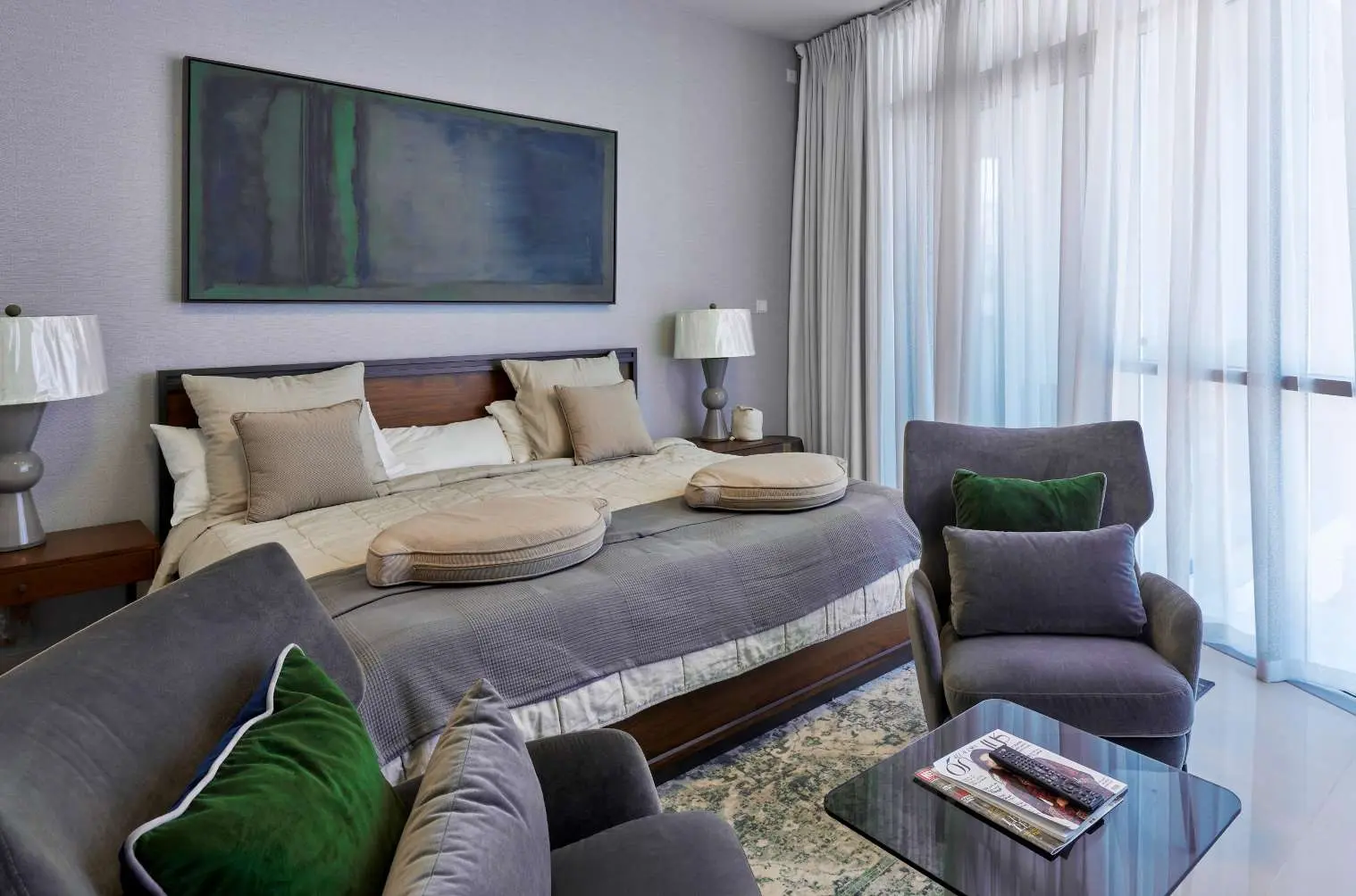 Stylish guest bedroom inside Julphar Residence apartments on Al Reem Island.