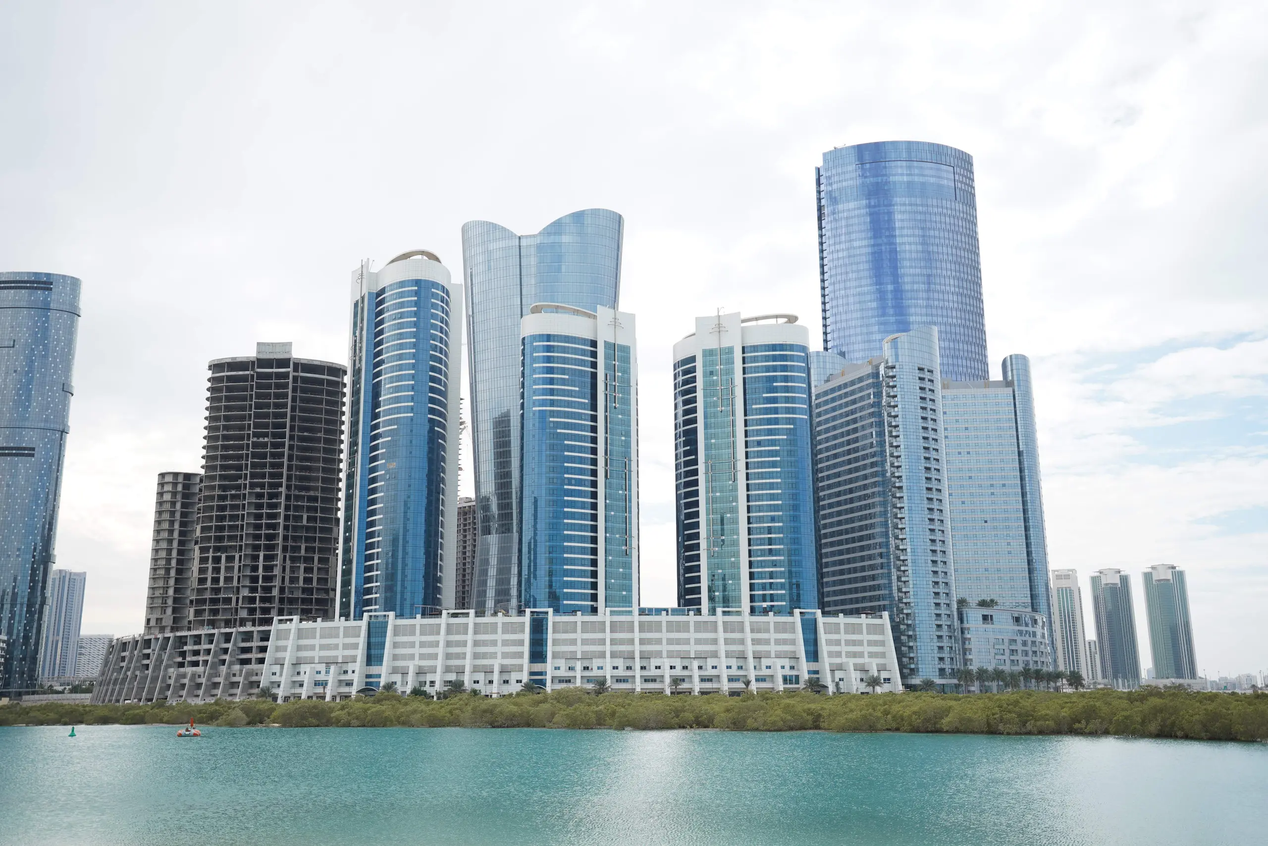 Sigma Tower Al Reem Island Abu Dhabi twin tower exterior view showing Sigma 1 and Sigma 2 buildings
